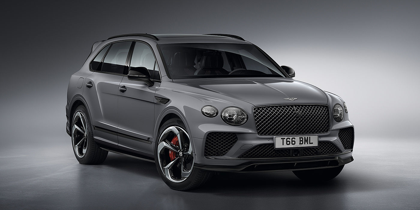 Bentley Basel Bentley Bentayga S in Cambrian Grey paint front three - quarter view with dark chrome matrix grille and featuring elliptical LED matrix headlights. 