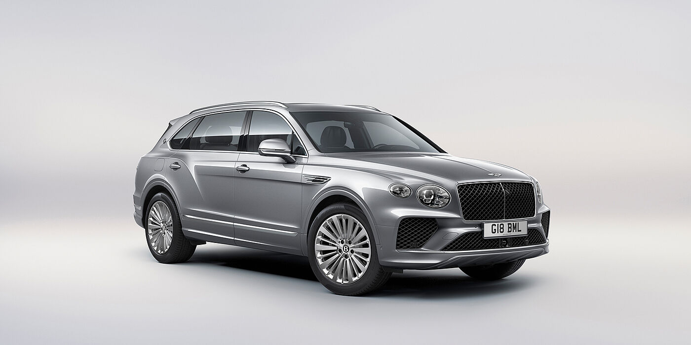 Bentley Basel Bentley Bentayga Extended Wheelbase luxury SUV front three quarter view in Moonbeam paint with 21 inch five spoke painted wheels