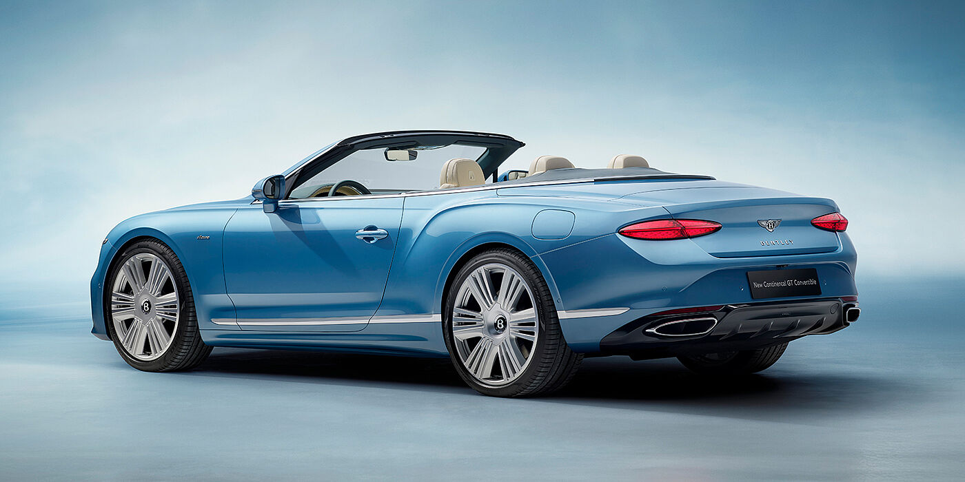 Bentley Basel New Bentley Continental GTC Azure convertible rear view in Light Windsor blue paint with 22 inch ten spoke wheels and chrome exterior details