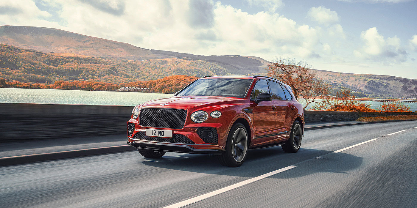 Bentley Basel Bentley Bentayga S SUV in Candy Red paint front 34 dynamic