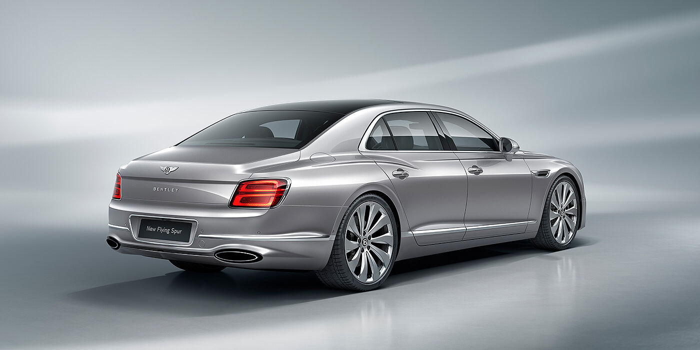 Bentley Basel New Bentley Flying Spur sedan rear view in Silverlake paint with ten spoke wheels and chrome matrix grille