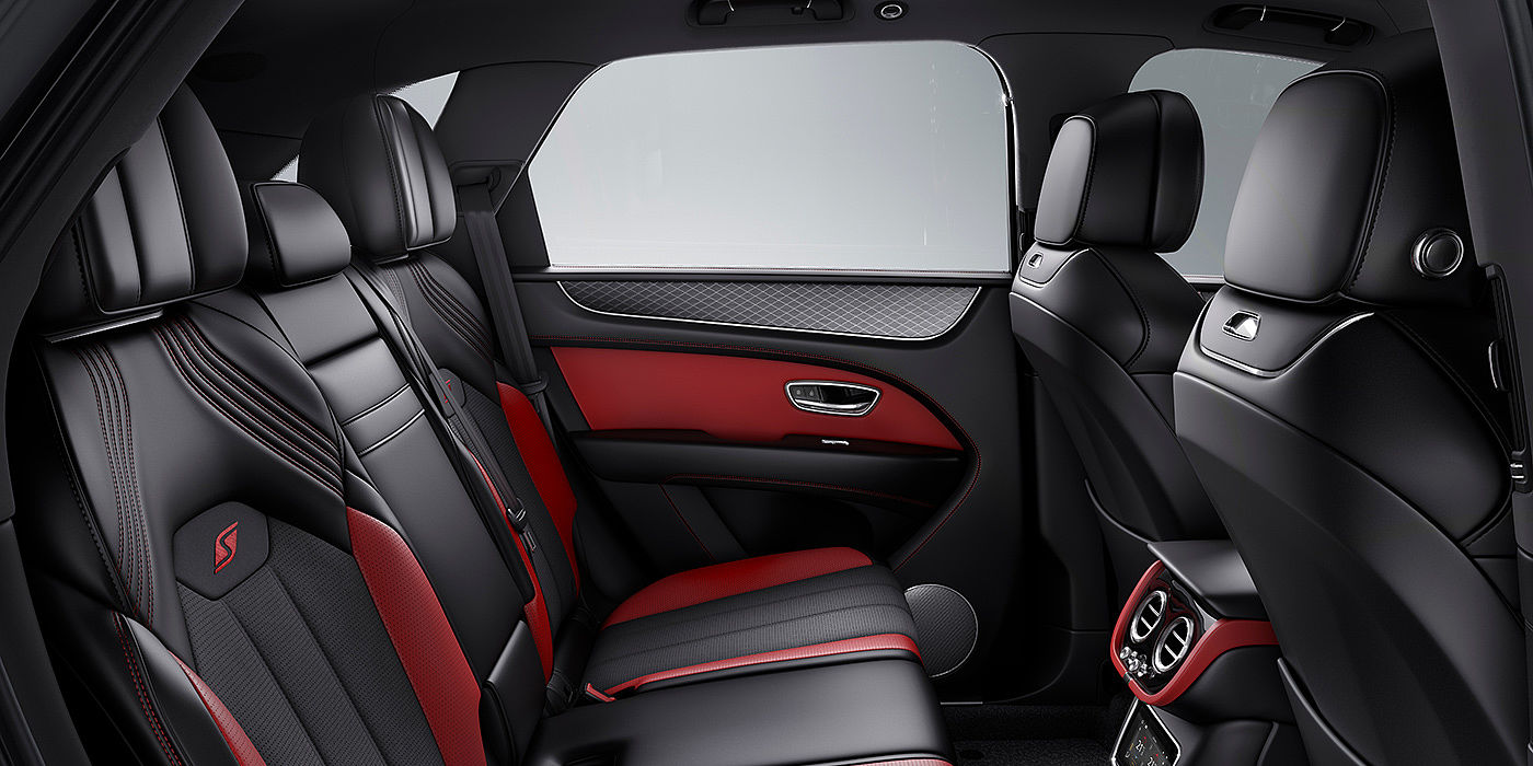 Bentley Basel Bentey Bentayga S interior view for rear passengers with Beluga black and Hotspur red coloured hide.