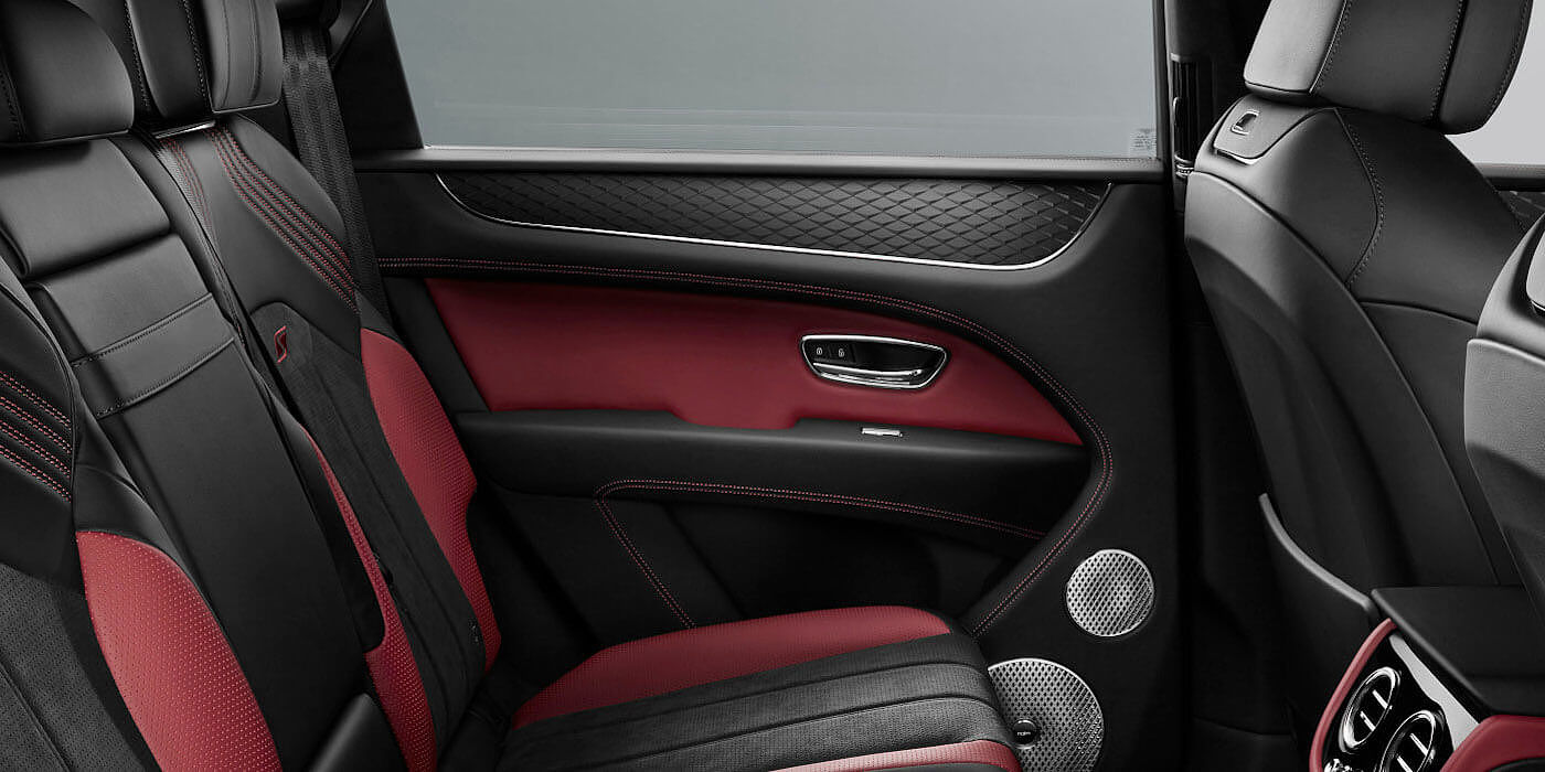 Bentley Basel Bentley Bentayga S SUV rear interior in Beluga black and Hotspur red hide
