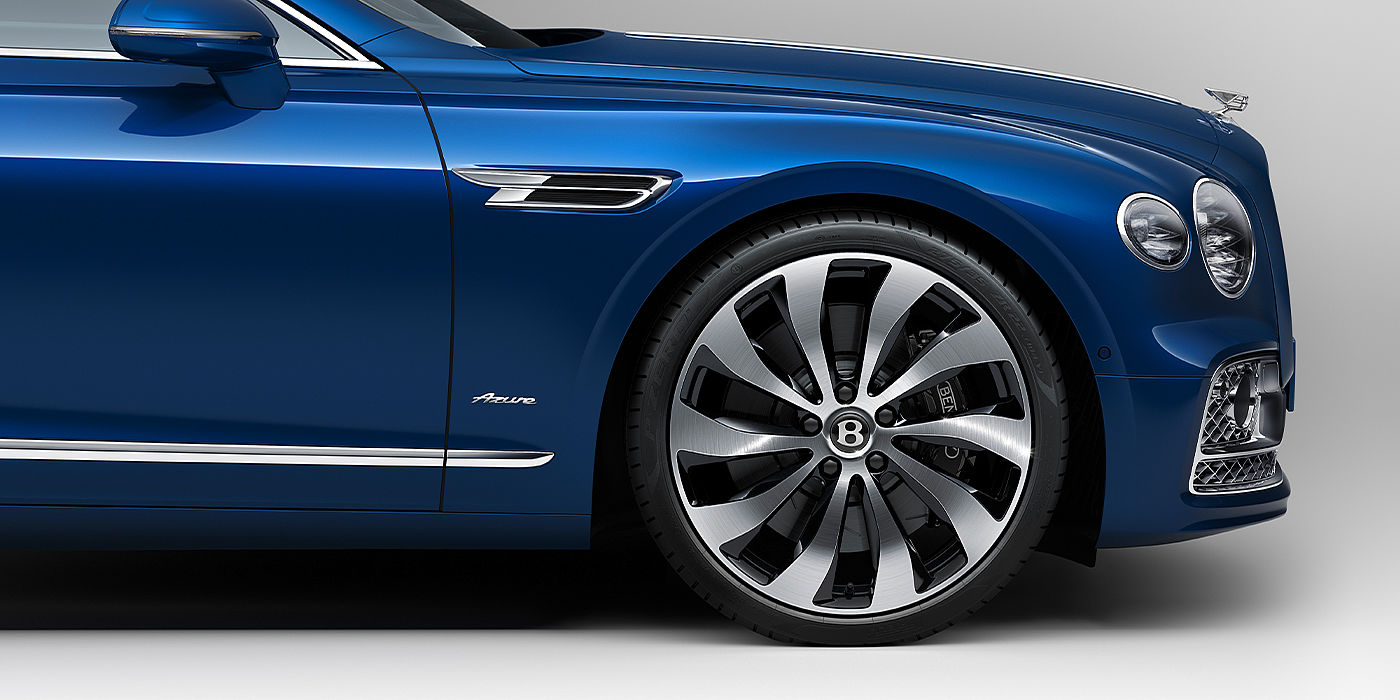 Bentley Basel Bentley Flying Spur Azure sedan side close up in Sequin Blue paint with Azure badge