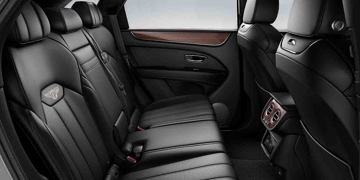 Bentley Basel Bentley Bentayga EWB interior view for rear passengers with Beluga black hide.