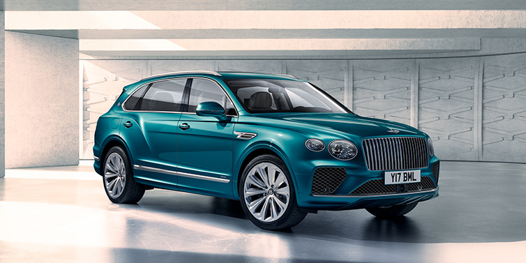 Bentley Basel Bentley Bentayga Extended Wheelbase Azure SUV front three quarter in Topaz blue paint colour with a grey background