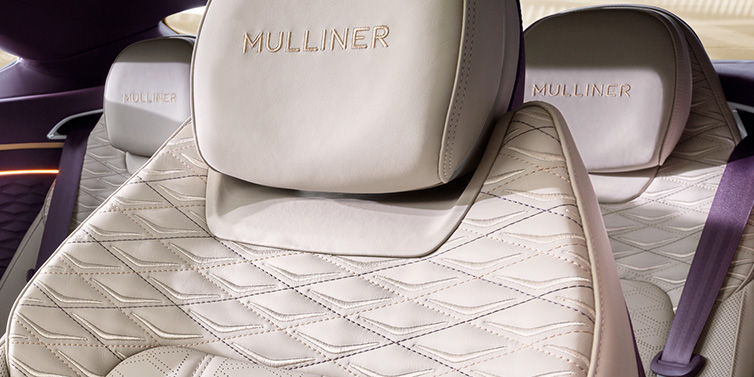 Bentley Basel Bentley Continental GT Mulliner coupe seat detail in Linen leather with Mulliner Diamond in Diamond quilting and Mulliner embroidered seat emblem