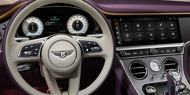 Bentley Basel Bentley Continental GTC Mulliner convertible steering wheel and drivers screens surrounded by Damson purple and Linen hides